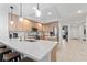 Modern kitchen features stainless steel appliances, an island, and plenty of cabinets for storage at 125 Island Way # 402, Clearwater Beach, FL 33767
