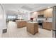 Bright, open kitchen with an island, stainless steel appliances and view to living area at 125 Island Way # 402, Clearwater Beach, FL 33767