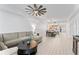 Bright living room with an open-concept design, dining area, and modern kitchen at 125 Island Way # 402, Clearwater Beach, FL 33767