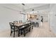 Spacious living area with an open-concept design, dining table, and modern kitchen at 125 Island Way # 402, Clearwater Beach, FL 33767