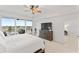 Spacious main bedroom featuring a ceiling fan, dresser, and access to a private balcony at 125 Island Way # 402, Clearwater Beach, FL 33767
