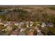 An aerial view of the property and neighborhood, showcasing its proximity to natural landscapes and quiet street at 12956 Royal George Ave, Odessa, FL 33556