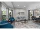 Comfortable living room featuring ample seating, stylish decor, and natural light at 12956 Royal George Ave, Odessa, FL 33556