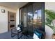 This covered balcony has green views and a place to enjoy the weather at 1324 Pasadena S Ave # 204, South Pasadena, FL 33707