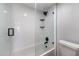 Modern bathroom featuring white tile, a black shower head, and black finishes at 1324 Pasadena S Ave # 204, South Pasadena, FL 33707
