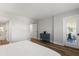 Bedroom featuring hardwood floors, balcony access, and blue cabinet at 1324 Pasadena S Ave # 204, South Pasadena, FL 33707