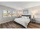 Bright bedroom with a large window and hardwood floors at 1324 Pasadena S Ave # 204, South Pasadena, FL 33707