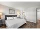 Bedroom featuring hardwood floors, and view of bathroom at 1324 Pasadena S Ave # 204, South Pasadena, FL 33707