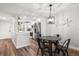 Open-concept kitchen and dining area with sleek table, chairs, and modern finishes at 1324 Pasadena S Ave # 204, South Pasadena, FL 33707