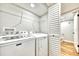 Convenient laundry room with Maytag washer and dryer, plus shelving for storage at 1324 Pasadena S Ave # 204, South Pasadena, FL 33707