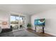 Bright living room with sliding glass doors leading to balcony and views at 1324 Pasadena S Ave # 204, South Pasadena, FL 33707