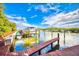 Beautiful marina view featuring multiple boats docked under a bright, partly cloudy sky at 1324 Pasadena S Ave # 204, South Pasadena, FL 33707