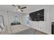 This primary bedroom is spacious with a mounted flat screen tv at 13826 Pathfinder Dr, Tampa, FL 33625