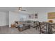 Stylish living room with modern decor, light gray wood-look flooring, and comfortable seating at 13826 Pathfinder Dr, Tampa, FL 33625