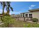 Waterfront home features a private wooden deck overlooking a serene lake view at 1518 New Bedford Dr, Sun City Center, FL 33573