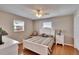 Bedroom featuring wood floors and lots of natural light from the windows at 1518 New Bedford Dr, Sun City Center, FL 33573