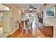 Dining room with wood table and chairs, hardwood flooring, and built in cabinetry at 1518 New Bedford Dr, Sun City Center, FL 33573