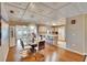 Spacious dining area with hardwood floors, stylish chandelier, and a seamless flow into the kitchen at 1518 New Bedford Dr, Sun City Center, FL 33573