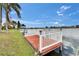 Private dock extending into the water, providing an ideal spot for relaxation and waterfront activities at 1518 New Bedford Dr, Sun City Center, FL 33573