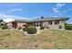 Well-kept single-story home with lovely landscaping around the perimeter at 1518 New Bedford Dr, Sun City Center, FL 33573