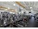 Spacious gym featuring modern exercise equipment, high ceilings, and multiple televisions at 1518 New Bedford Dr, Sun City Center, FL 33573