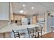Spacious, bright kitchen with stainless appliances, white cabinets and tiled floors, perfect for cooking at 1518 New Bedford Dr, Sun City Center, FL 33573