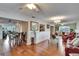 Bright and airy living area with a mix of seating arrangements and hardwood floors at 1518 New Bedford Dr, Sun City Center, FL 33573