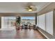 Bright office area with a water view, showcasing large windows, a modern desk, and sleek wood floors at 1518 New Bedford Dr, Sun City Center, FL 33573