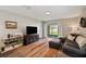 Bright living room with sliding glass doors leading to the backyard at 16222 Silent Sands Ln, Odessa, FL 33556