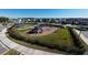 Community playground featuring slides, climbing structures, and a covered picnic area for Gathering enjoyment at 16222 Silent Sands Ln, Odessa, FL 33556
