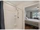 Shower boasts tiled walls, a shower caddy, and a handheld shower head at 16222 Silent Sands Ln, Odessa, FL 33556