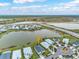 Community aerial view showcasing serene lakes, well-maintained landscaping and numerous single-Gathering homes at 17541 Corkwood Bend Trl, Punta Gorda, FL 33982