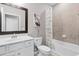 Well-lit bathroom features a white sink vanity, framed mirror, and shower-tub combination at 17541 Corkwood Bend Trl, Punta Gorda, FL 33982