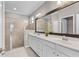 Bathroom featuring double sink vanity and glass enclosed shower at 17541 Corkwood Bend Trl, Punta Gorda, FL 33982