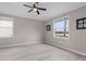 Bright bedroom features wood-look floors, neutral walls and view of exterior at 17541 Corkwood Bend Trl, Punta Gorda, FL 33982