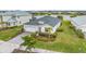 Charming one-story home with well-manicured landscaping and a two-car garage near a lake at 17541 Corkwood Bend Trl, Punta Gorda, FL 33982