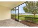Relaxing screened patio overlooking a tranquil pond and lush greenery at 17541 Corkwood Bend Trl, Punta Gorda, FL 33982