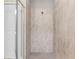 Spacious, tiled shower with glass door and neutral color palette at 17541 Corkwood Bend Trl, Punta Gorda, FL 33982