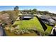 An aerial shot displaying a large backyard near the river, enclosed by a black fence at 18614 San Rio Cir, Lutz, FL 33549