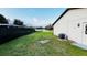 Private backyard with black fence offering serene water views, ideal for enjoying nature at 18614 San Rio Cir, Lutz, FL 33549