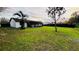 Spacious backyard with lush green lawn and privacy fence, perfect for outdoor entertaining and relaxation at 18614 San Rio Cir, Lutz, FL 33549