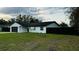 Charming single-story home featuring a well-maintained lawn, dark fenced in yard and an attached two-car garage at 18614 San Rio Cir, Lutz, FL 33549