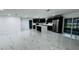 Open-concept kitchen boasts stainless steel appliances and sleek cabinetry with views of the bright living area at 18614 San Rio Cir, Lutz, FL 33549