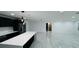 Spacious living room with sleek marble floors, recessed lighting, and an open layout at 18614 San Rio Cir, Lutz, FL 33549