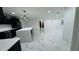 Spacious living room with sleek marble floors, recessed lighting, and an open layout at 18614 San Rio Cir, Lutz, FL 33549