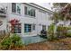 Rear exterior with patio, grill, and lush landscaping, great for outdoor living at 2100 World Parkway Blvd # 30, Clearwater, FL 33763