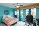 Bright bedroom with bed, desk, and a large window offering ample natural light at 2100 World Parkway Blvd # 30, Clearwater, FL 33763