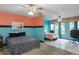 Spacious bedroom featuring two beds, ceiling fans, and unique two-tone paint at 2100 World Parkway Blvd # 30, Clearwater, FL 33763