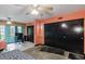 Bedroom with two beds, ceiling fan, closet, and a work area with large windows at 2100 World Parkway Blvd # 30, Clearwater, FL 33763