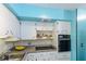 Kitchen featuring white cabinets, modern appliances including a range and built in oven and ample counter space at 2100 World Parkway Blvd # 30, Clearwater, FL 33763